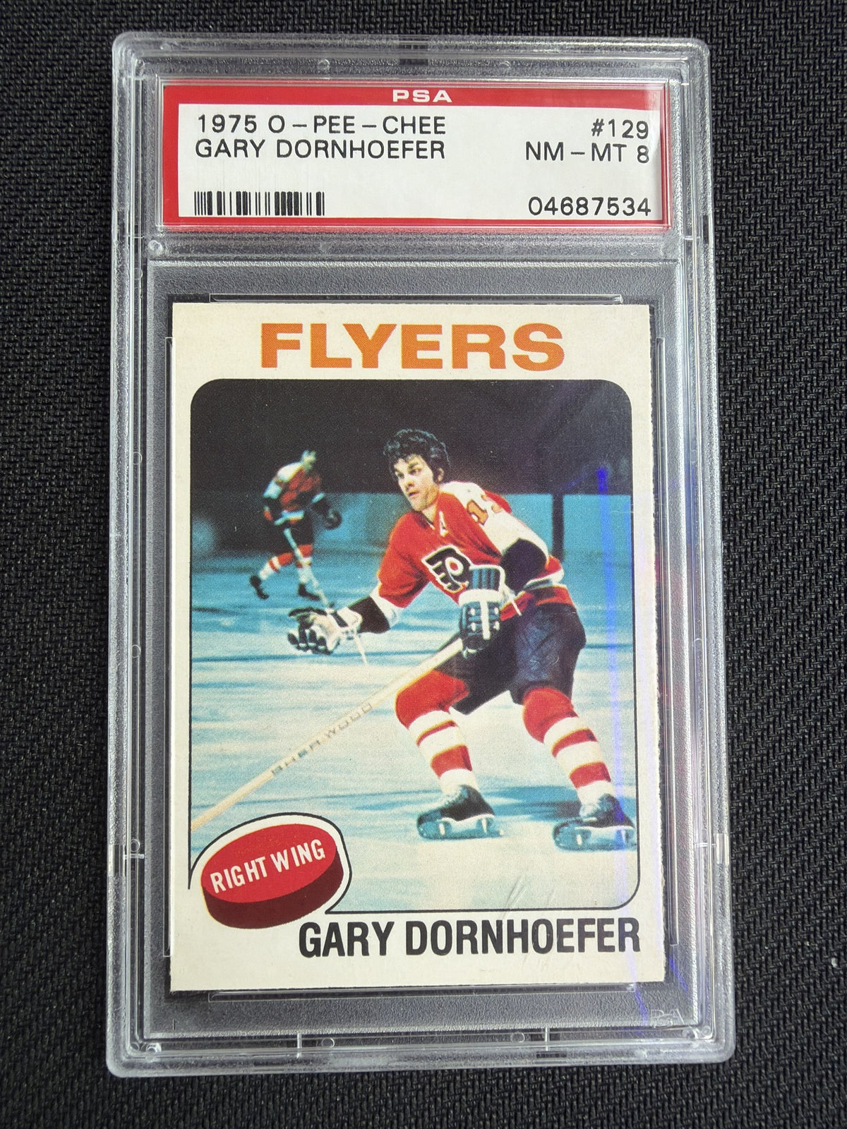 PSA cert 04687534 front slab — 1975 O-Pee-Chee #129 Gary Dornhoefer PSA 8 NM-MT